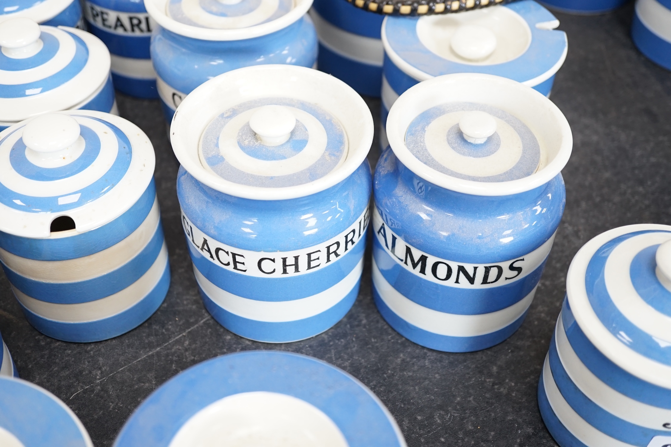 T.G.Green Cornish Kitchenware, seventeen assorted lidded jars, to include Marmalade, Treacle, Glacé Cherries, Biscuits, Pearl Barley and Mixed Peel, largest 14cm high, mainly Black Shield marks. Condition - fair to good
